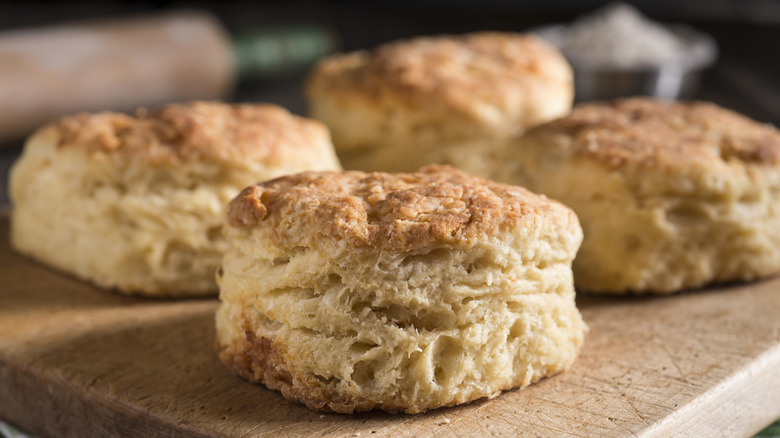 Fresh buttermilk biscuits on a cutting board
