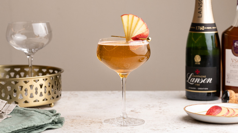 sparkling apple Champagne cocktail with apple garnish