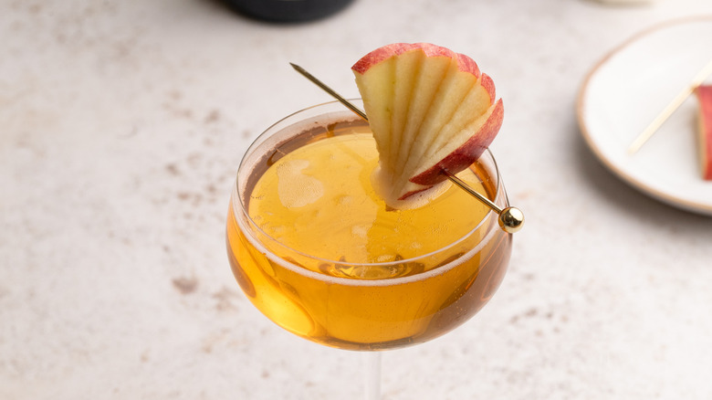 sparkling apple Champagne cocktail with apple garnish