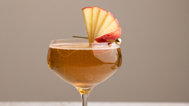 sparkling apple Champagne cocktail with apple garnish