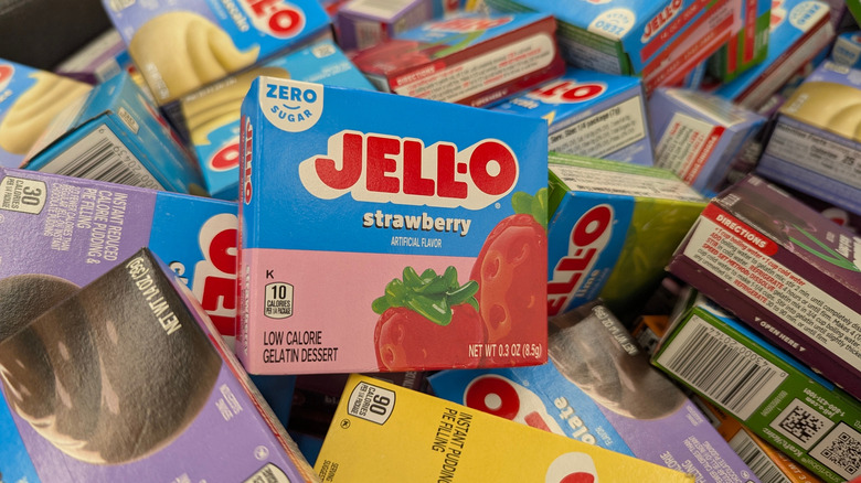 Pile of Jell-O boxes with strawberry on top