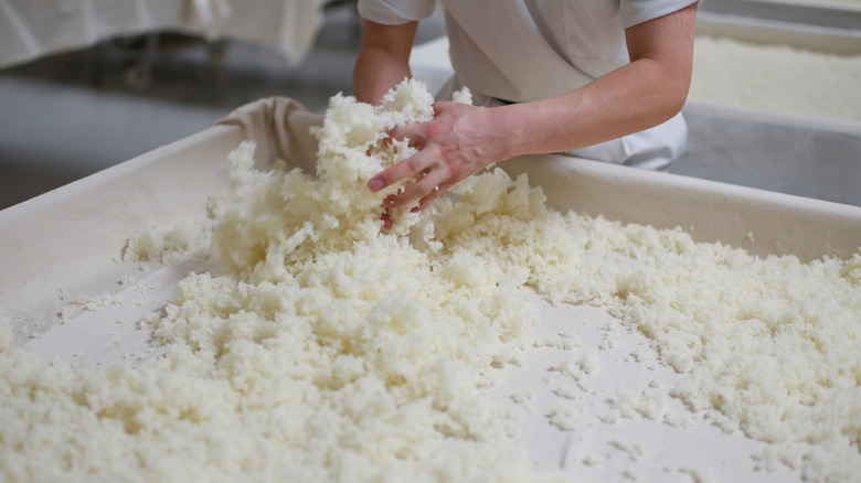 Worker processing rice for sake making
