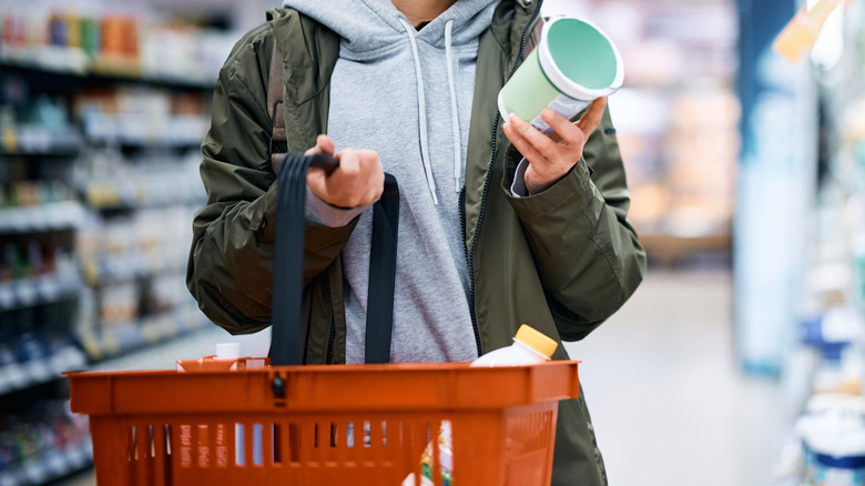 shopper looking at food label