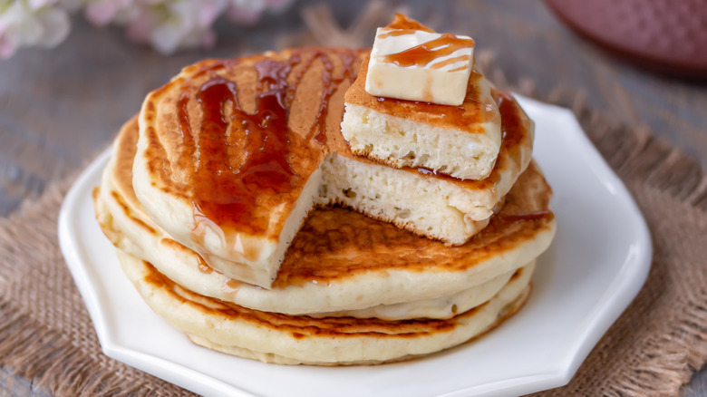 fluffy stack of pancakes on plate