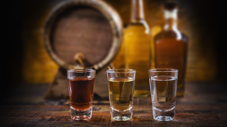 three shades of tequila in lined up glasses