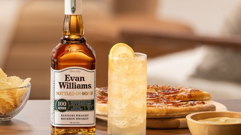 Bottle of Evan Williams Bottled-in-Bond with lemon drink