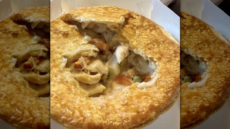 KFC chicken pot pie with the crust partially removed