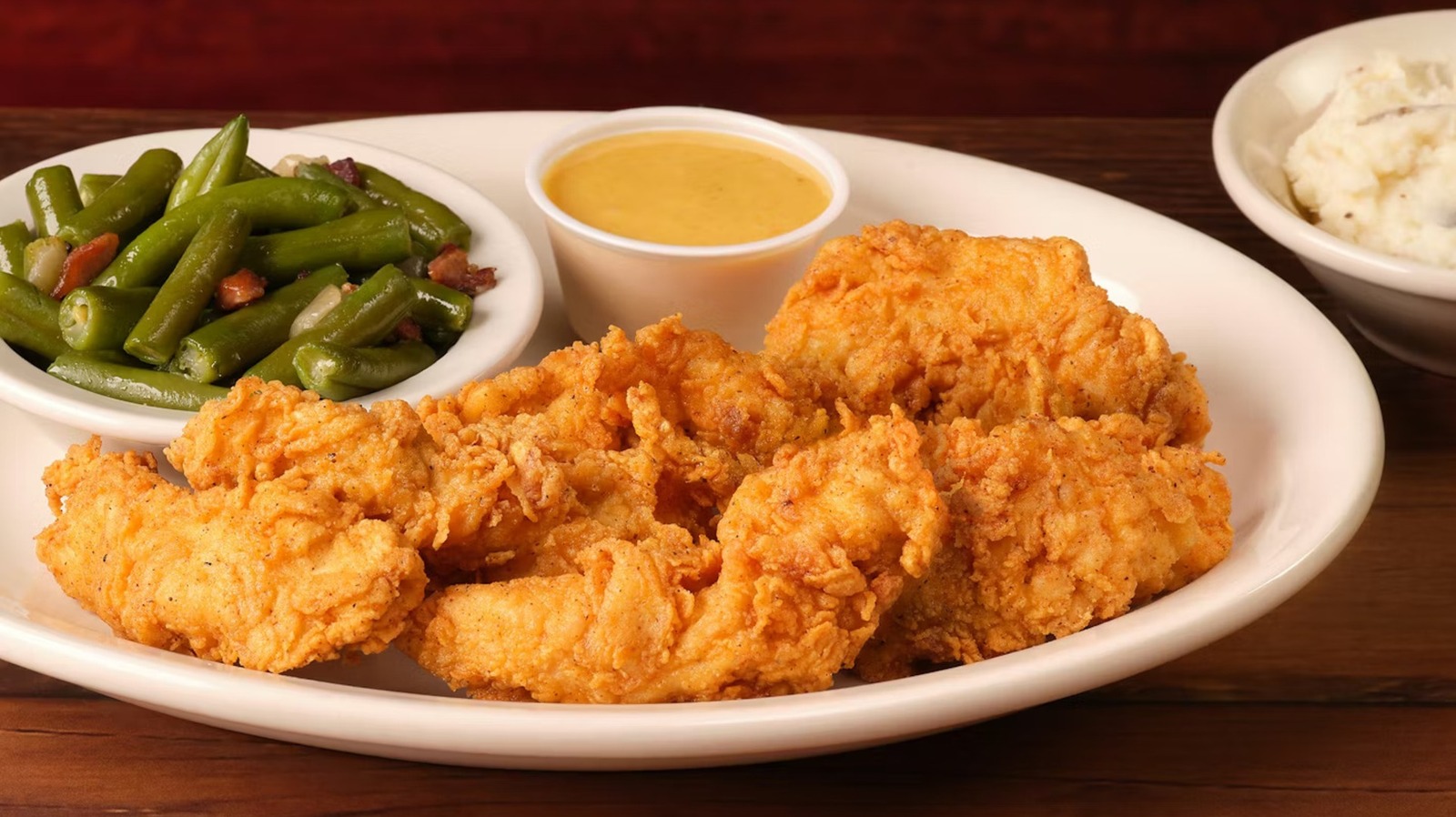 This Unusual Flavor Combo Might Be What Makes Texas Roadhouse Chicken Tenders So Good - Tasting Table