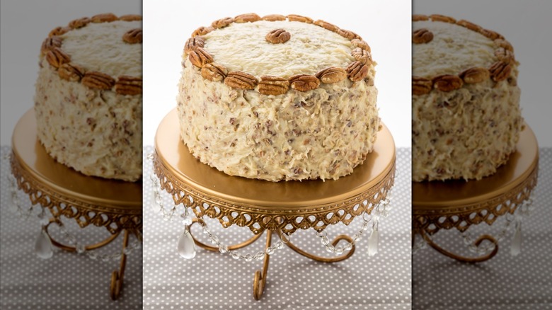 Italian cream cake topped with pecans