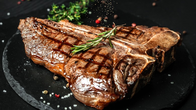 seasoned steak on stone platter
