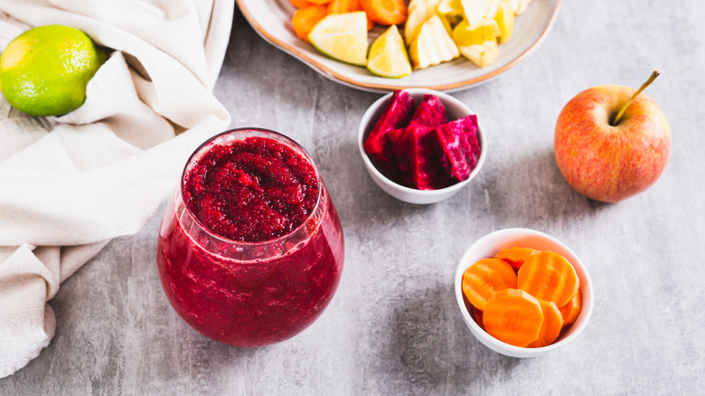 Aerial view of ABC juice ingredients with full glass