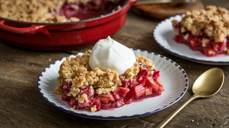strawberries and rhubarb on a wooden board