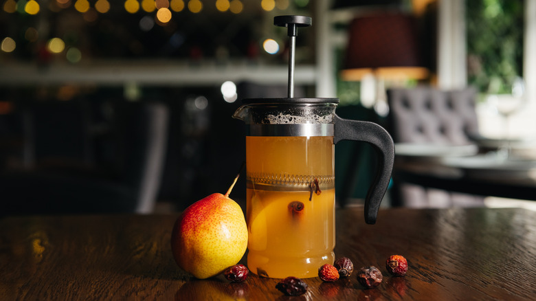 French press filled with juice