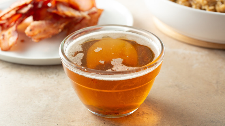 Rendered bacon fat in a small glass bowl