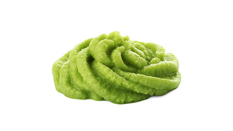 Swirl of wasabi paste on a white background