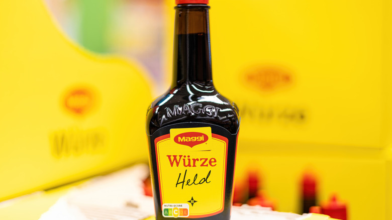 Bottle of Maggi seasoning on a yellow background