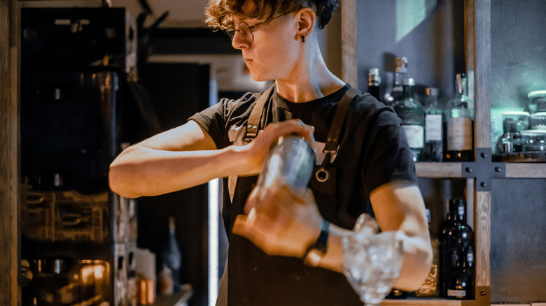 Bartender shaking a cocktail