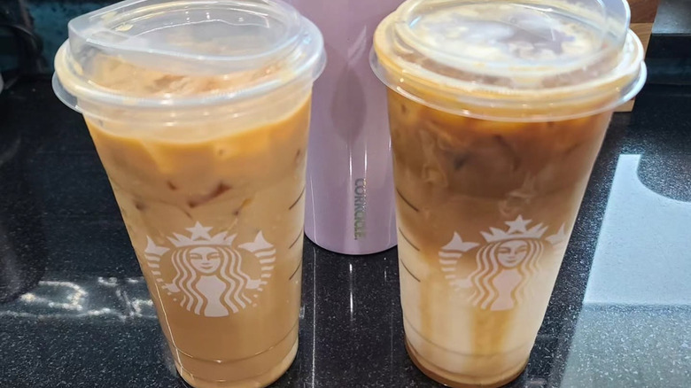 two venti iced caramel macchiatos from Starbucks