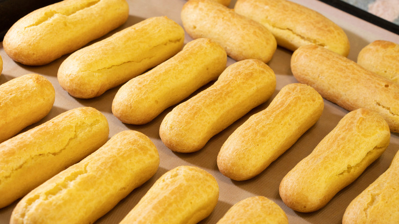 baked eclairs on baking sheet
