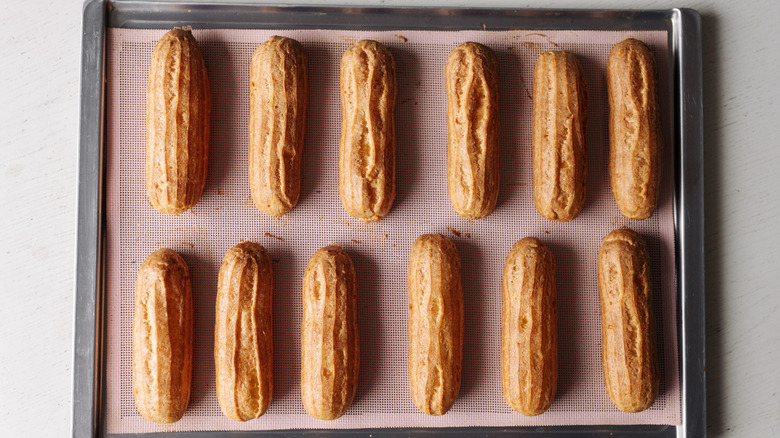 browned eclairs on baking sheet