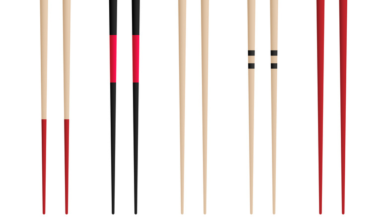 A set of chopsticks. Japanese sushi stick, Chinese, Asian food. A colored chopstick. Traditional asian bamboo utensils colored chopstick.