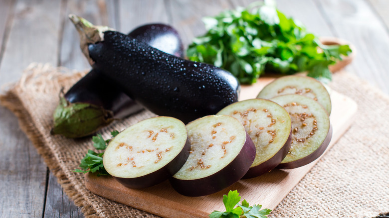 Sliced eggplant on cutting board
