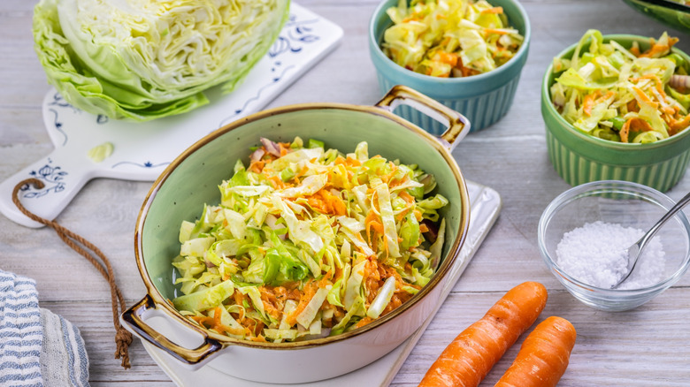 Bowls of coleslaw and ingredients