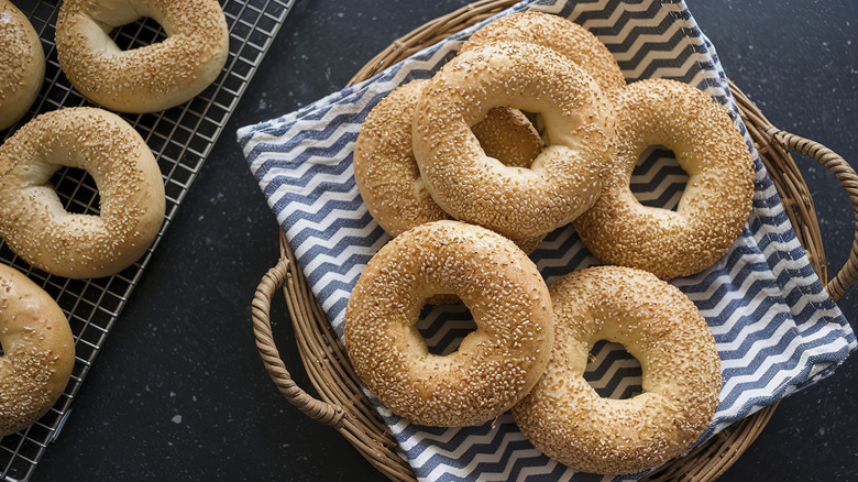 Basket and tray of sesame bagels