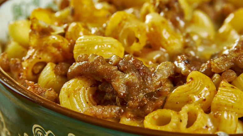 a close up look at a Johnny Marzetti casserole with macaroni noodles and ground beef