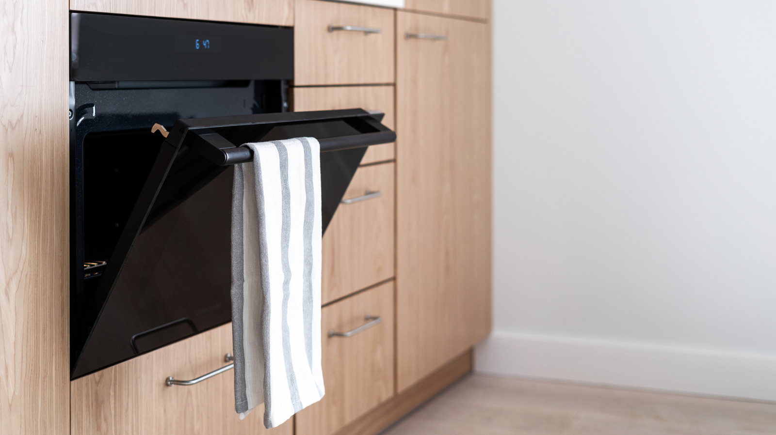 Tired Of Your Kitchen Towels Sliding Off The Oven? Try This Easy Fix - Tasting Table