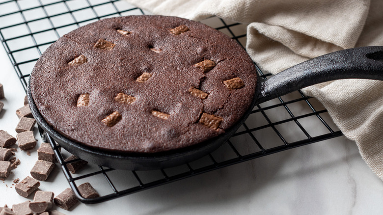 Chocolate brownie baked in cast-iron pan