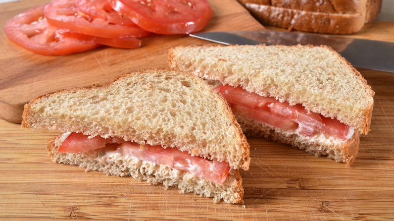 A tomato sandwich sliced in half