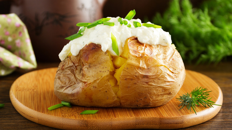 Close-up of a baked potato topped with cream sauce
