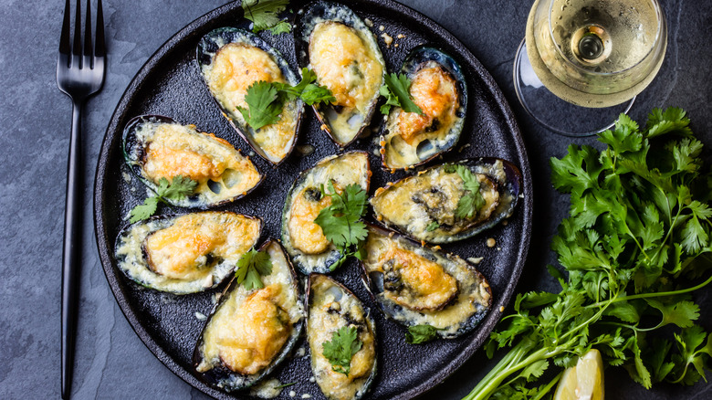 baked mussels served with cheese