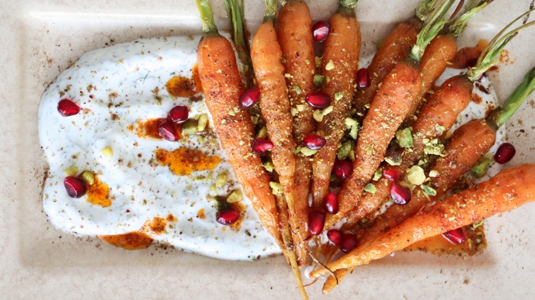 Carrots, yogurt, pomegranate, and pistachio