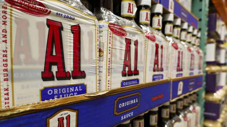 Cases of A1 steak sauce on display on a store shelf