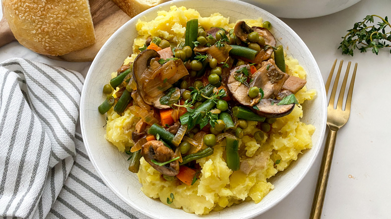 Mashed potatoes and mushroom stew in bowl
