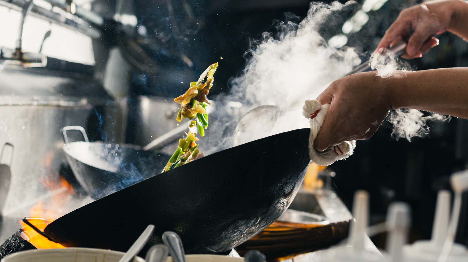 https://www.tastingtable.com/img/gallery/top-ten-tips-you-need-when-cooking-with-a-wok/l-intro-1648736253.jpg