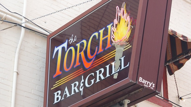 Exterior sign for Torch Bar and Grill