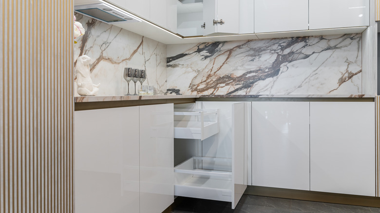 bottom cabinets in modern white kitchen