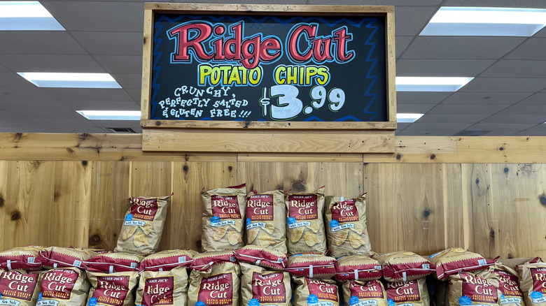 Sign for Trader Joe's ridge cut potato chips above bags of potato chips