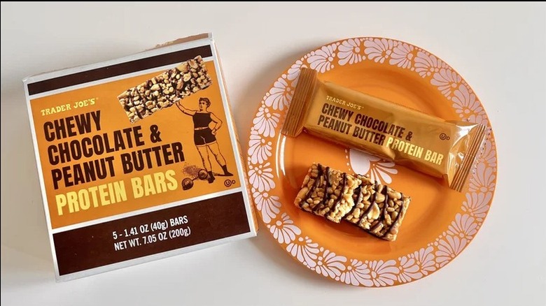 chewy chocolate peanut butter protein bar on an orange plate