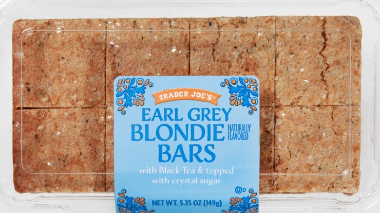 Cclear plastic box of Trader Joe's Earl Grey Blondie Bars on white background
