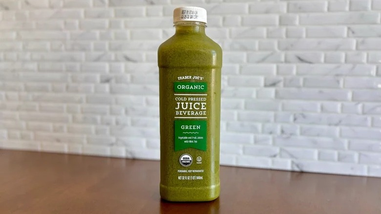 A plastic bottle of juice set on a table