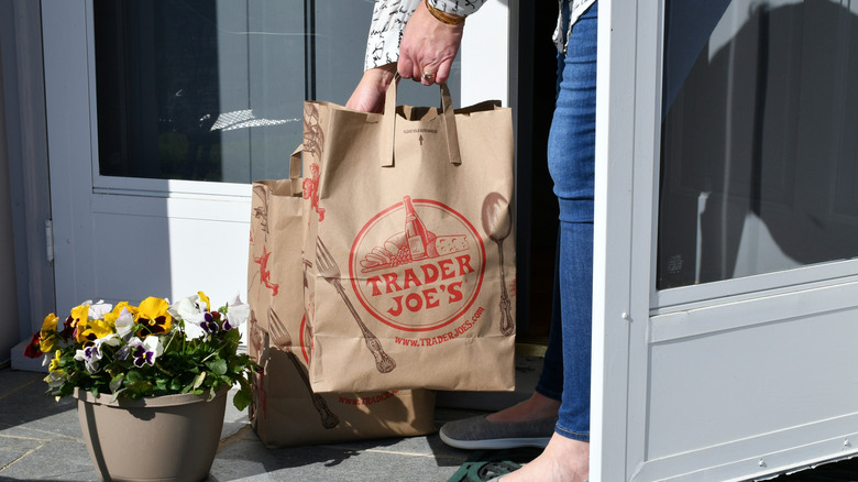 Trader Joe's customer with paper bags
