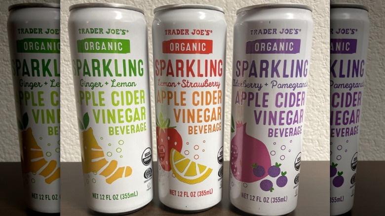 Three cans of Trader Joe's Organic Sparkling Apple Cider Vinegar Beverages