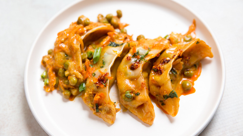 colorful dumplings served on table