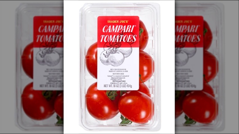 Campari tomatoes on a white surface
