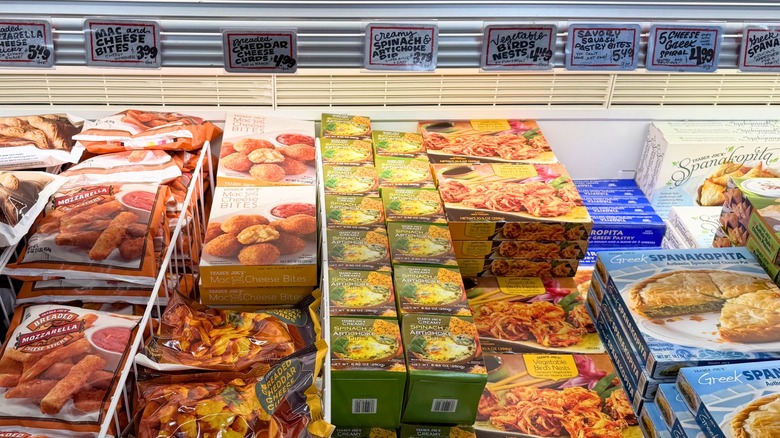 A variety of Trader Joe's frozen appetizers, in the freezer section of the store.