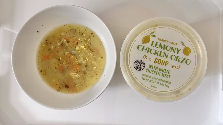 Bowl of Lemony Chicken Orzo Soup on a tray